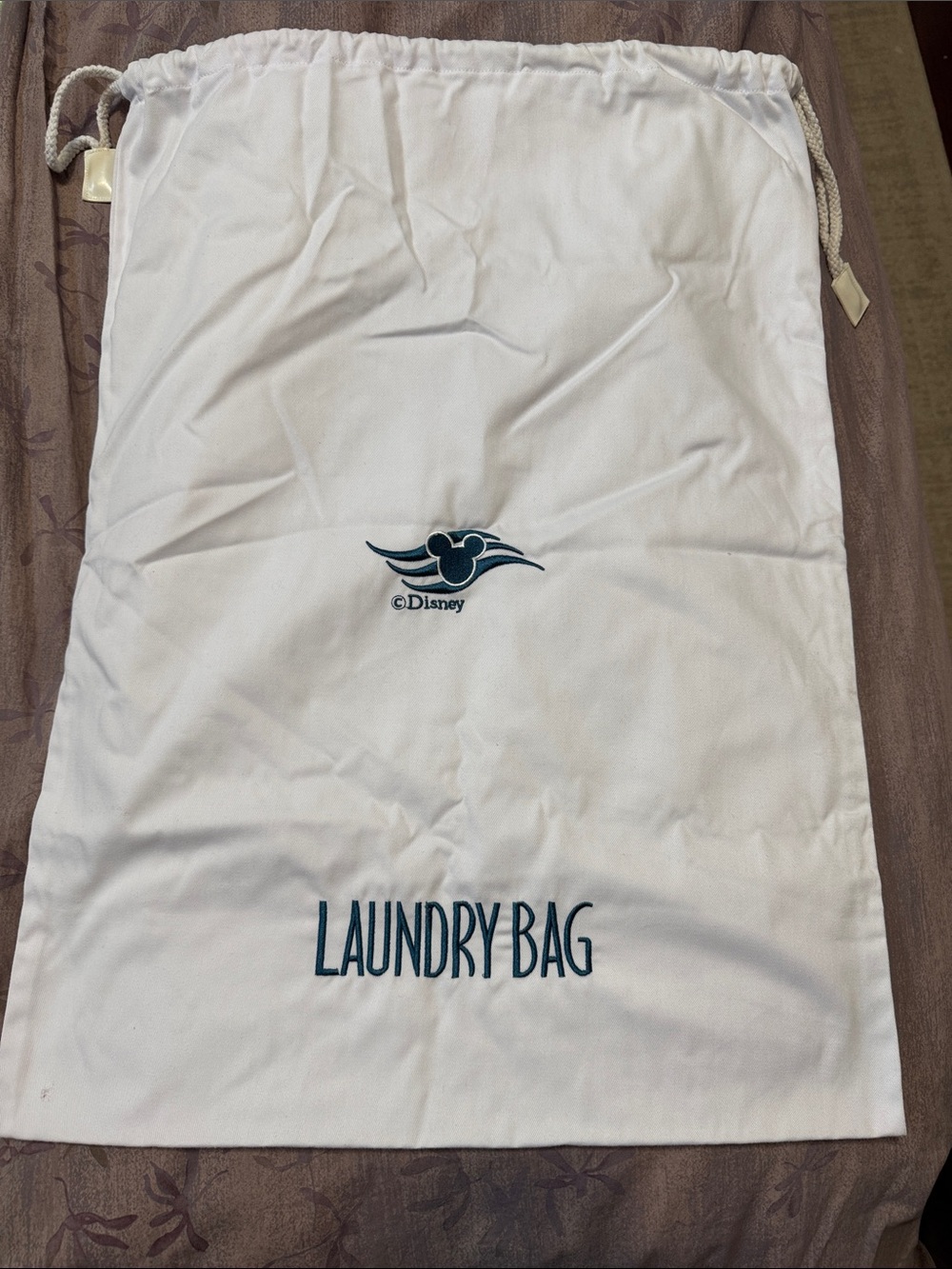 Disney Castaway Club White Laundry Bag with Aqua Green Logo and Text